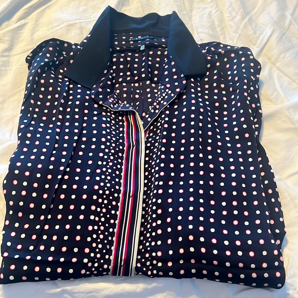 Stretch silk dark navy with double layer cross grain collar. Snap placket